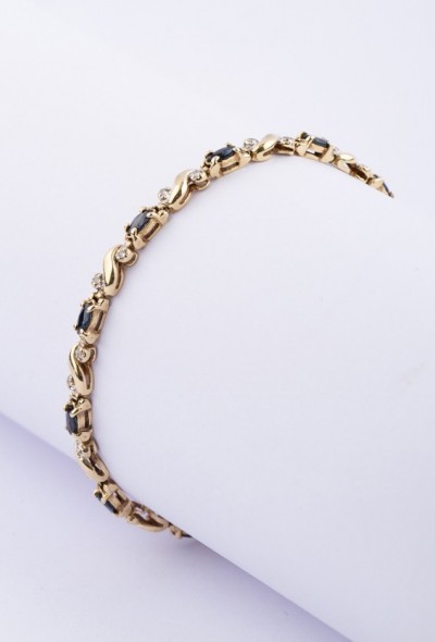 Gouden schakel armband met saffier en diamant