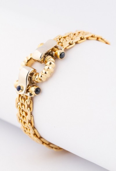 Wit/geel gouden armband met in de sluiting saffieren