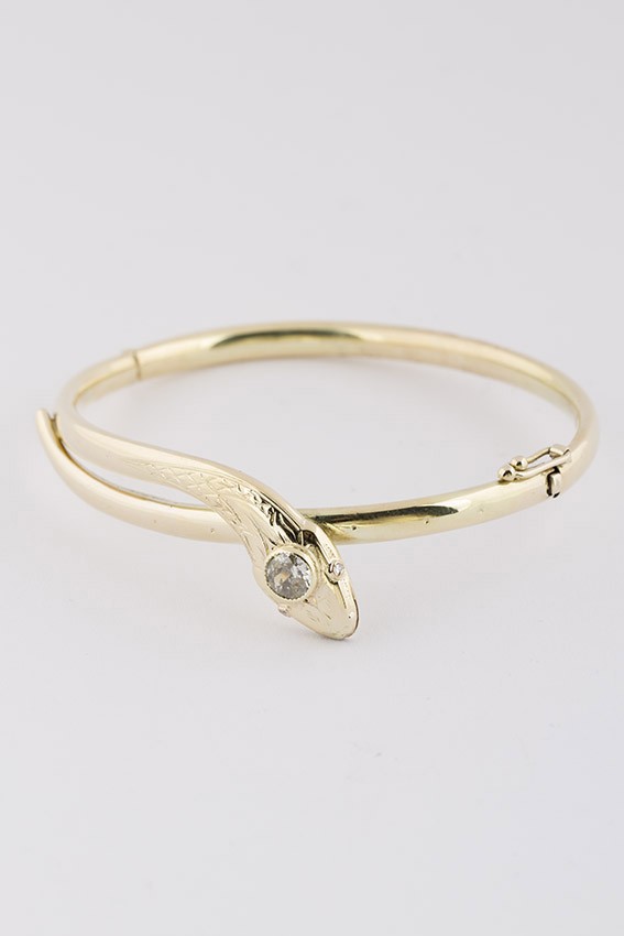 Oude 14 krt. gouden slangen armband met een van 0.55 ct. (Piqué) en scharniersluiting.