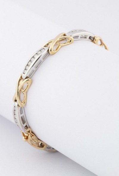 Wit/geel gouden schakelarmband met briljanten